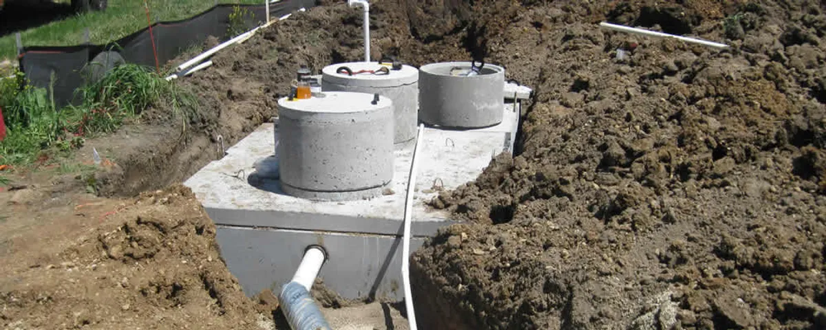 Septic system repair and installation site with tank access ports in Tulsa, OK