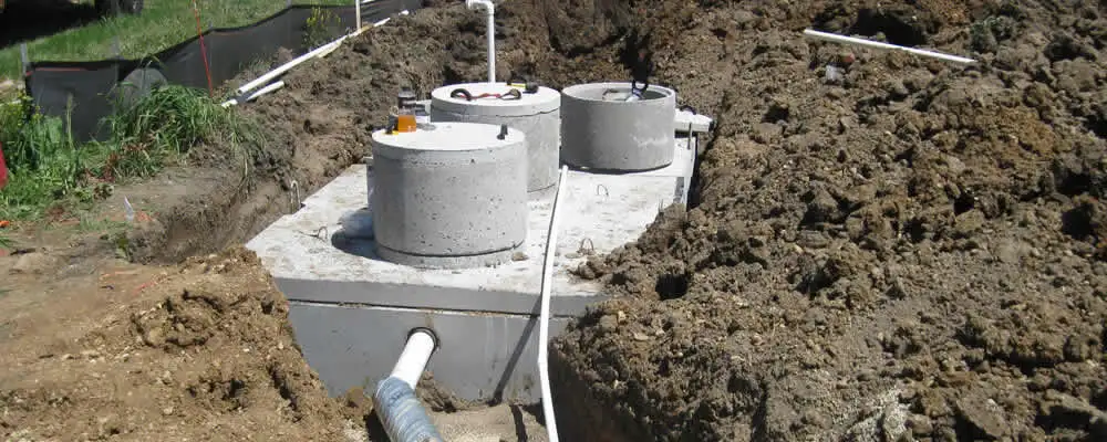 Septic system repair and installation site with tank access ports in Tulsa, OK