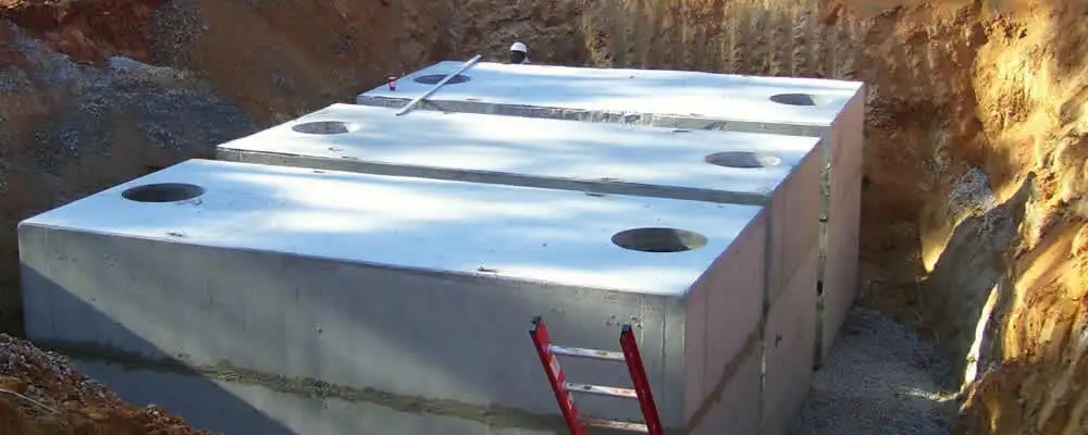 Septic tank installation site with a newly placed concrete tank in Tulsa, OK